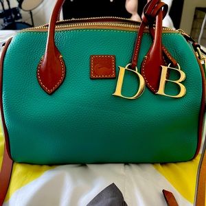 Dooney and Bourke pebble grain small satchel color is teal.
